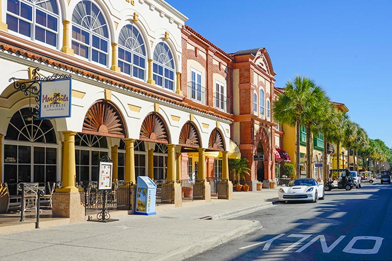 Palm trees and shops lining the street at The Villages in Florida.