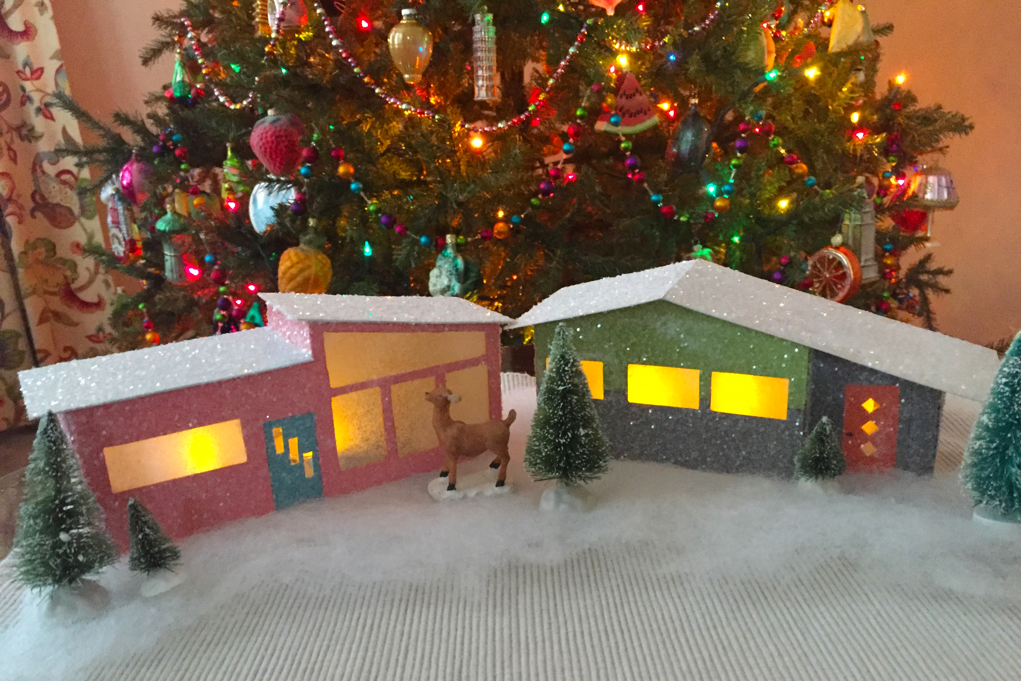 A holiday themed putz house is a great holiday craft activity to take on this year.
