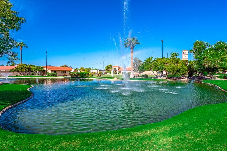 Lake with fountain at Leisure World active adult community in Mesa, Arizona.