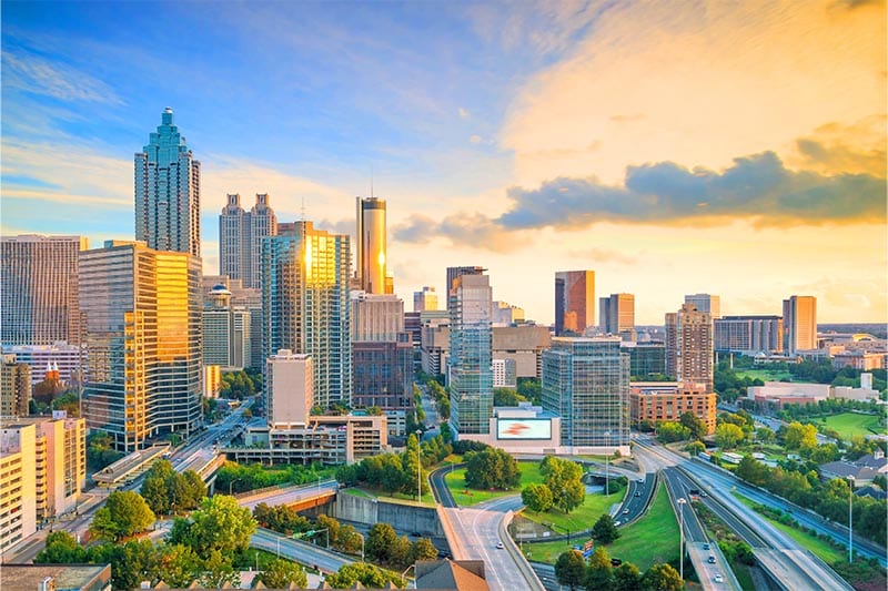 Downtown building reflecting the setting sun in the Atlanta, GA skyline.