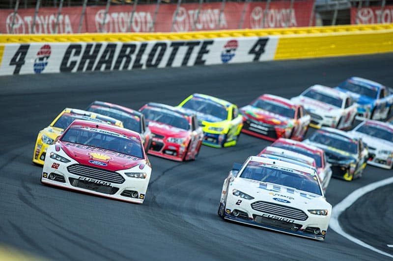 Cars racing at the Charlotte Motor Speedway in Concord, North Carolina.