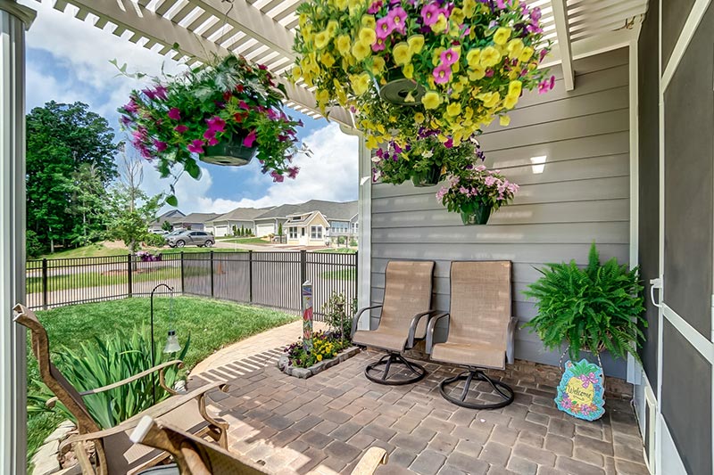 Chairs on a patio outside a model home in Bailey's Glen, a 55+ community in Cornelius, North Carolina.