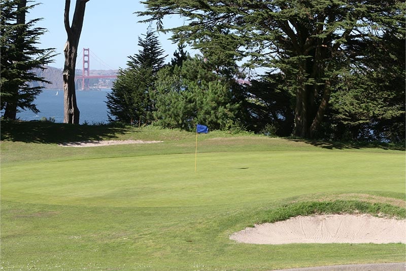 San Francisco area golf course with Golden Gate Bridge in the background.