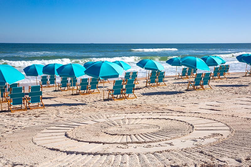 Lounge chairs on the beach at the Beach Club at Latitude Margaritaville