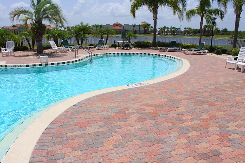 Lounge chairs surrounding the outdoor pool at Grand Isle in Melbourne, Florida