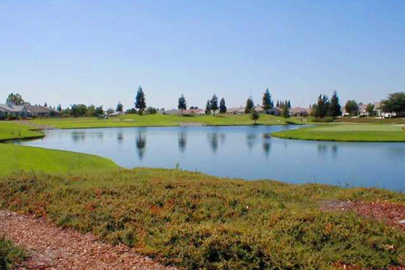 Homes surrounding a pond on the grounds of Sun City Roseville in Roseville, California.