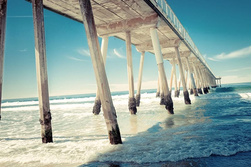 View of ocean and underside of pier in Redondo Beach, California.