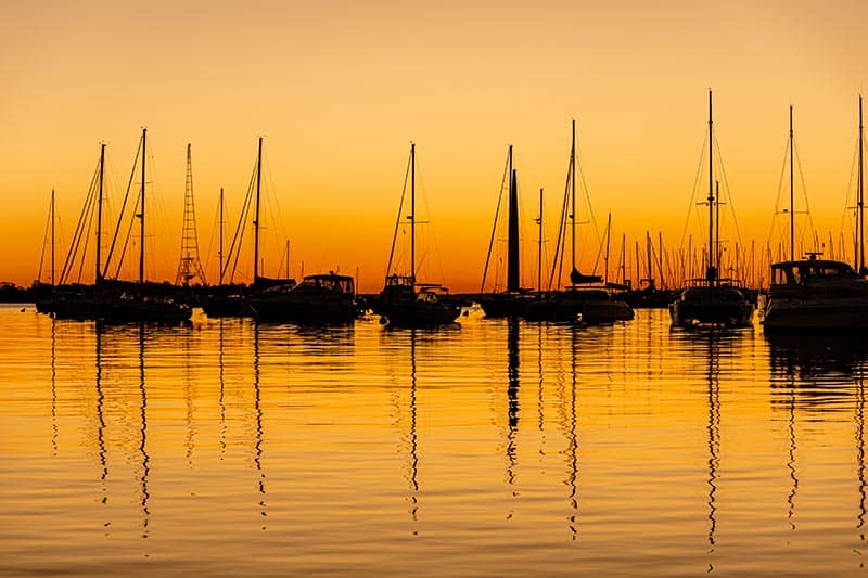 Sailboats moored at sunset on Chesapeake Bay.