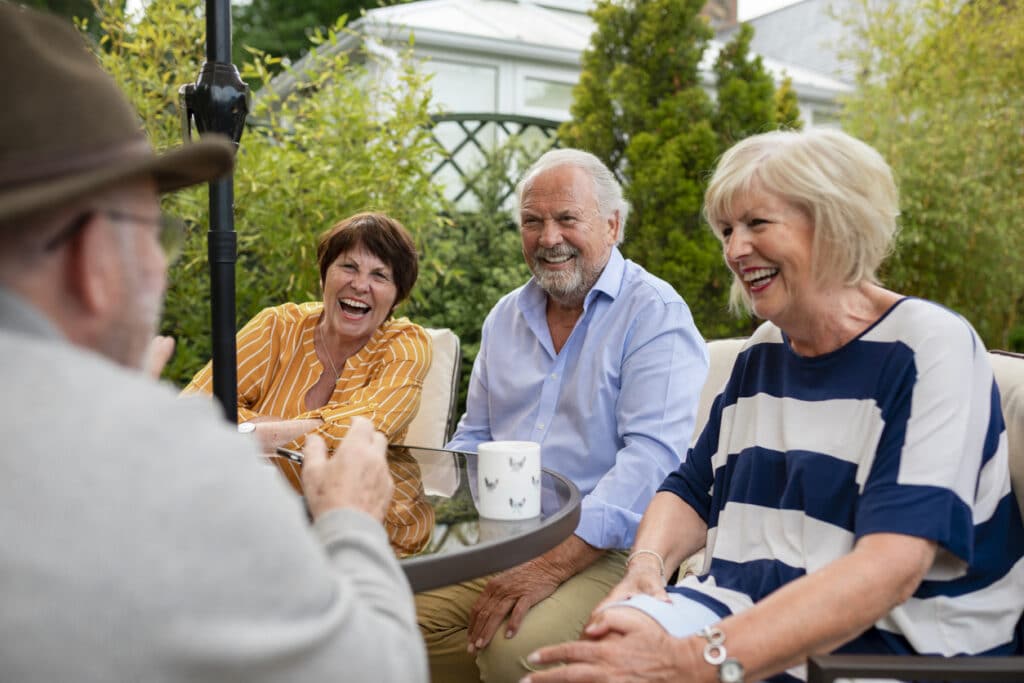 A group of older adults socialize within their 55+ community.