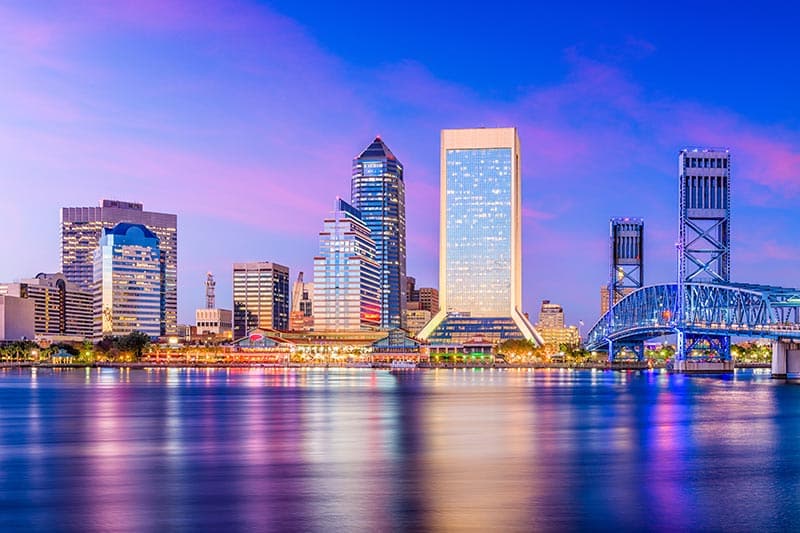 Twilight view across the water of the Jacksonville skyline.