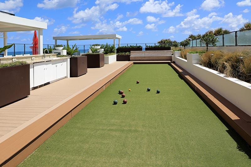 Resort community bocce ball court with balls in play.