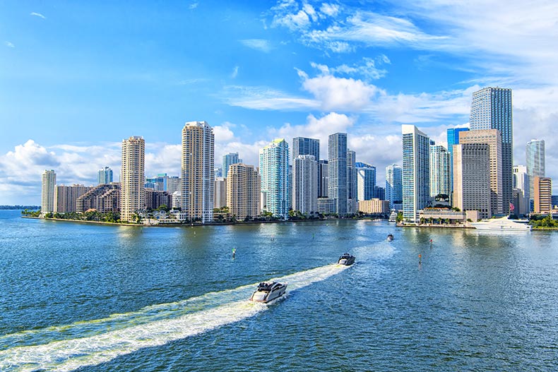 Aerial view of Miami skyscrapers against a blue sky.