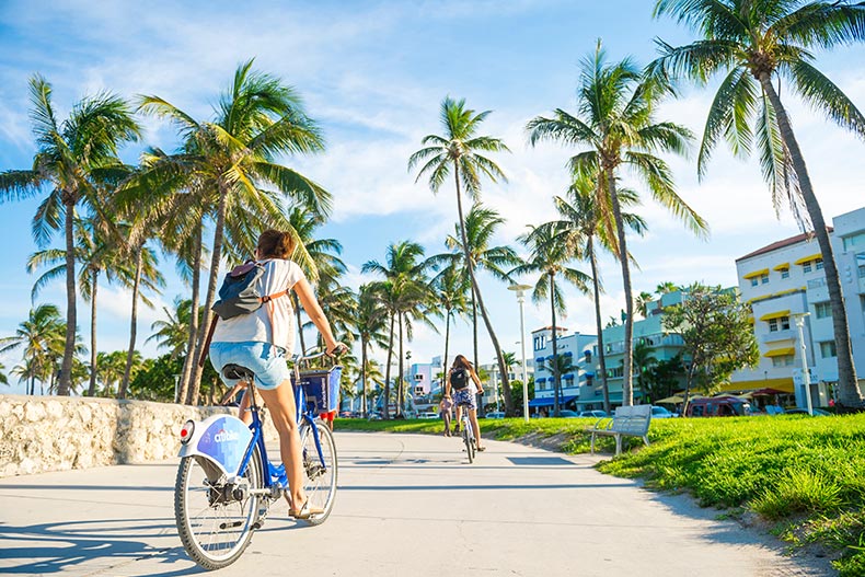 Bike riders along the Ocean Drive promenade in Miami Beach, Florida.