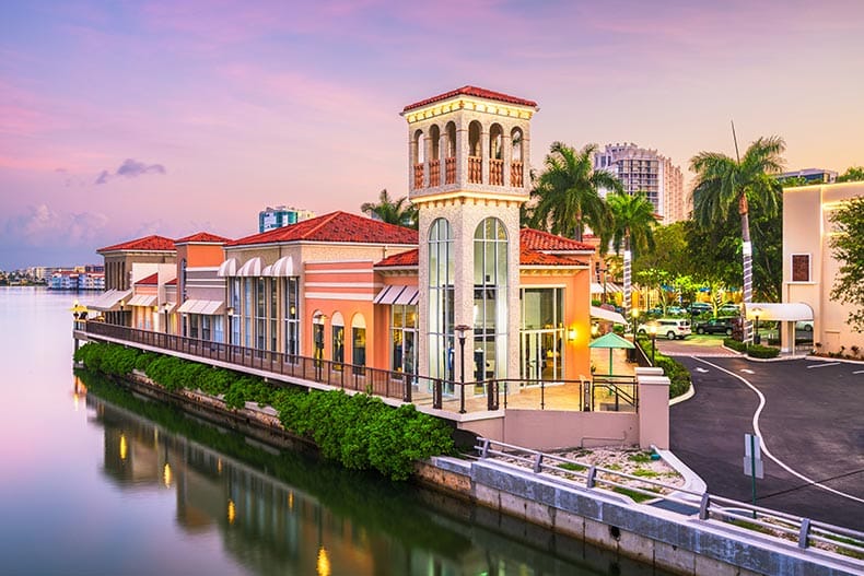 The downtown cityscape on the canals at dusk in Naples, Florida.