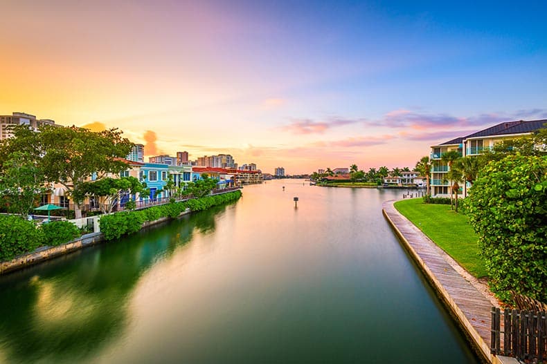 Naples, Florida downtown cityscape on the canals at dusk.