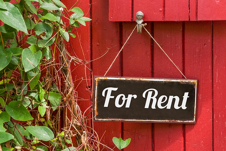 An old metal sign with the inscription "For Rent."