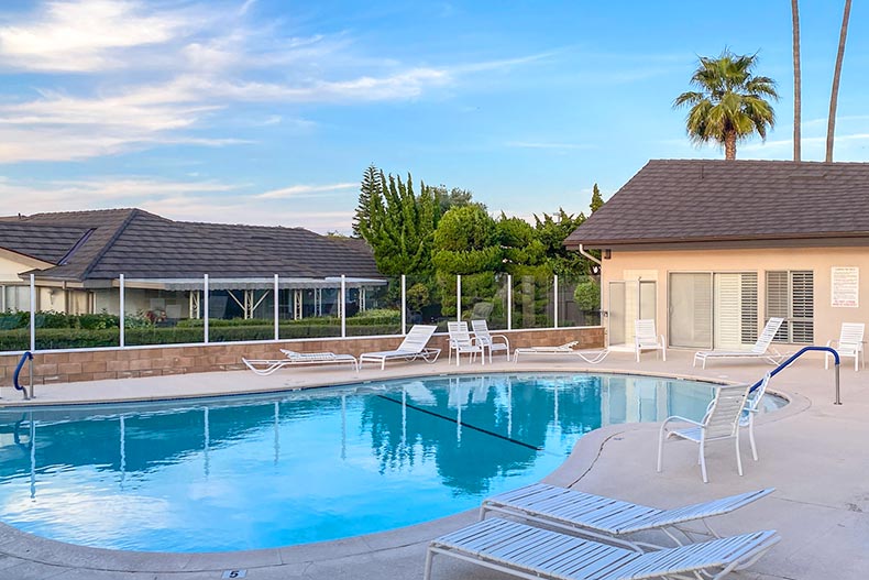 Lounge chairs beside the outdoor pool at New Horizons South Bay in Torrance, California.