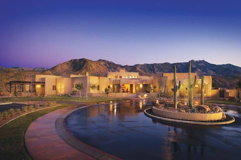 Twilight view of the community clubhouse at SaddleBrooke in Tucson, Arizona.