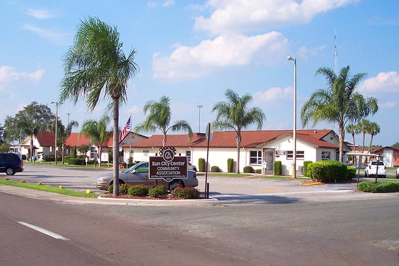 Palm trees surrounding a community building at Sun City Center in Sun City Center, Florida.