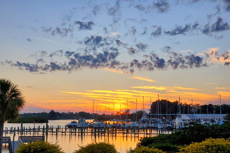 Sunset over boats at a dock in Tarpon Springs, Florida.