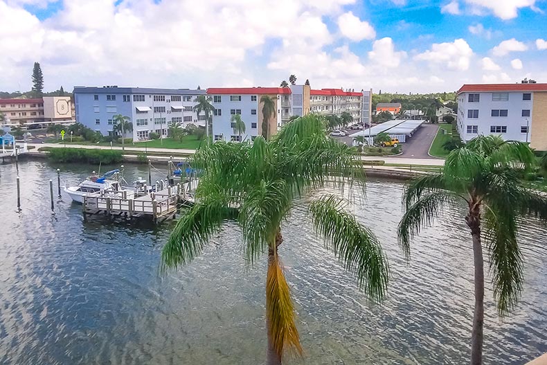 Aerial view of boats at a dock beside residential buildings at Town Shores of Gulfport in Gulfport, Florida.