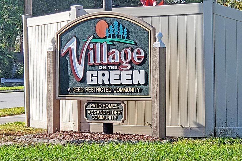 The community sign at the entrance of Village on the Green in Clearwater, Florida.