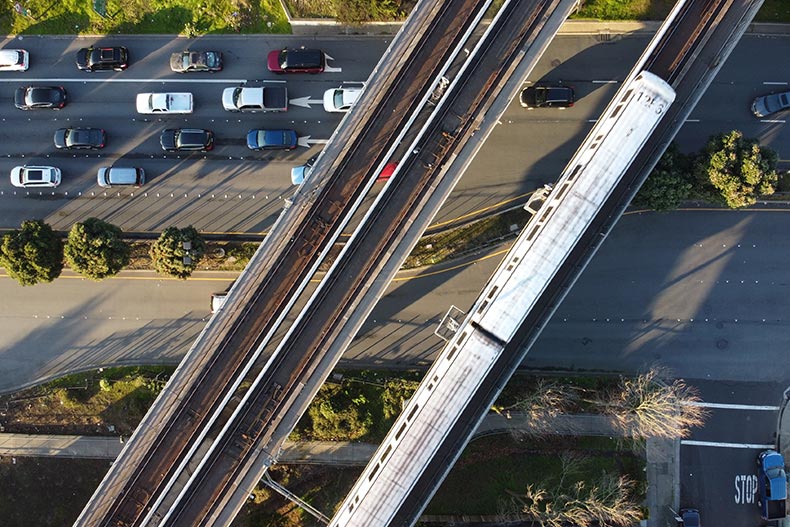 An aerial shot of the Bay Area Rapid Transit on the railways.