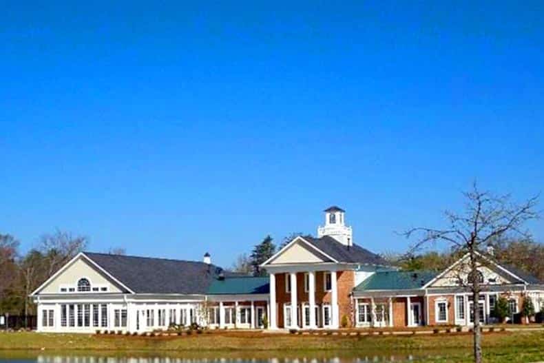 View across a pond of the clubhouse at Colonial Charles in Waldorf, Maryland.