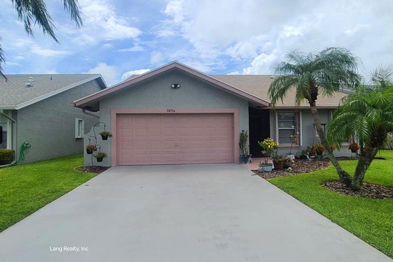 Exterior view of a home at Cypress Lakes West Palm Beach in West Palm Beach, Florida.