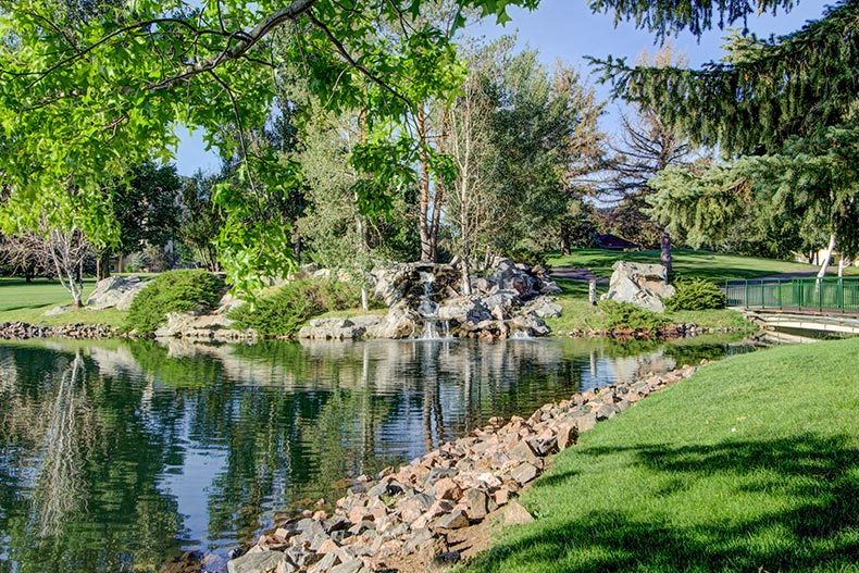 A pond beside a walking trail on the grounds of Heather Gardens in Aurora, Colorado.