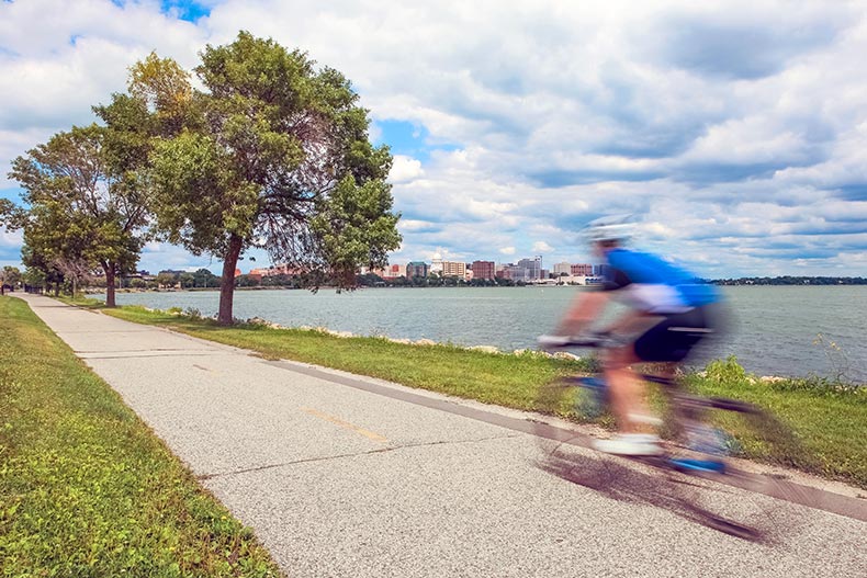 Motion blur of a person riding a bicycle on the bike path in Madison, Wisconsin.