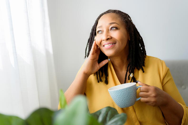 A mature woman relaxing at home in her 55+ community.