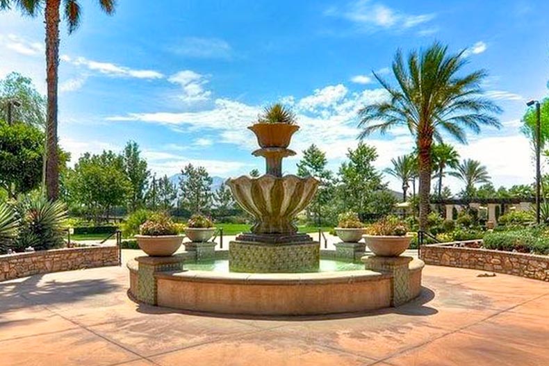 Palm trees surrounding a fountain on the grounds of Four Seasons at Beaumont in Beaumont, California.