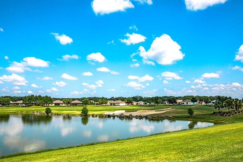 Homes beside a pond on the grounds of Stone Creek in Ocala, Florida.