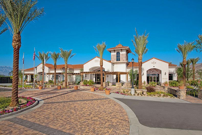 Palm trees beside the community entrance to Sun City Shadow Hills in Indio, California.