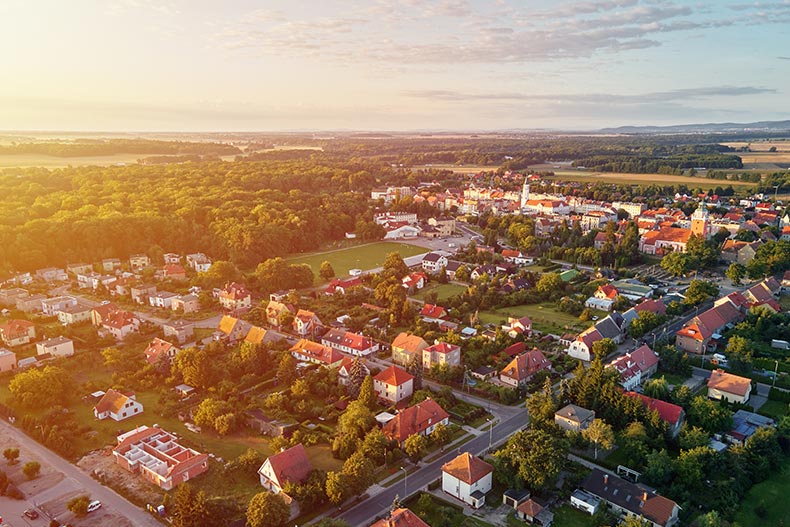 Aerial view of a suburban neighborhood at sunset.