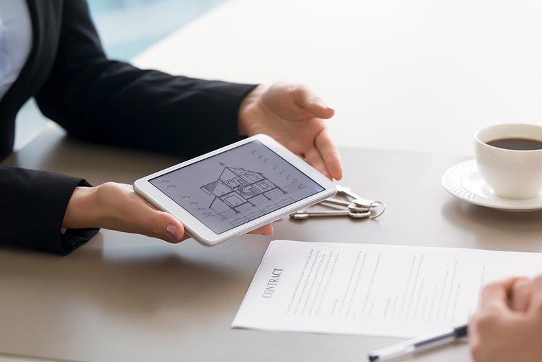 Close up of a tablet in with an architectural plan.