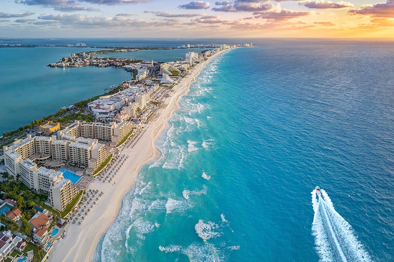 Aerial view of the Cancun Coast at sunset.