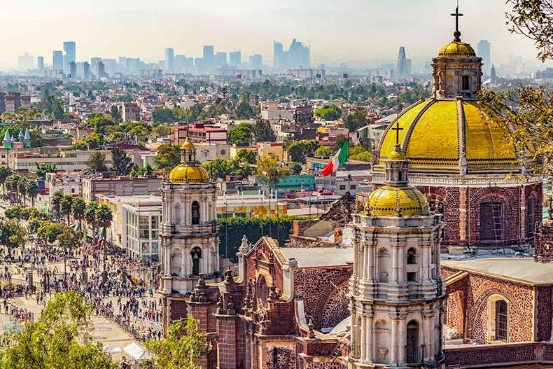 The Basilica of Our Lady of Guadalupe and the cityscape of Mexico City.