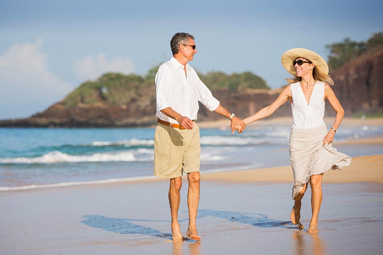 A happy senior couple on a beach in Mexico.