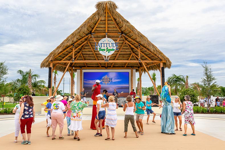 Residents dancing and having fun outside at Latitude Margaritaville in Daytona Beach, Florida.