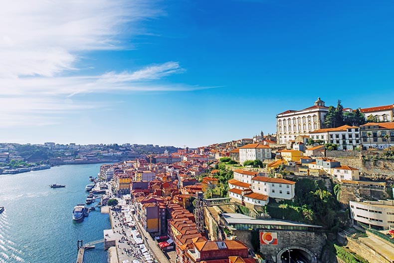 The old town skyline of Porto, Portugal from Dom Luis bridge on the Douro River.