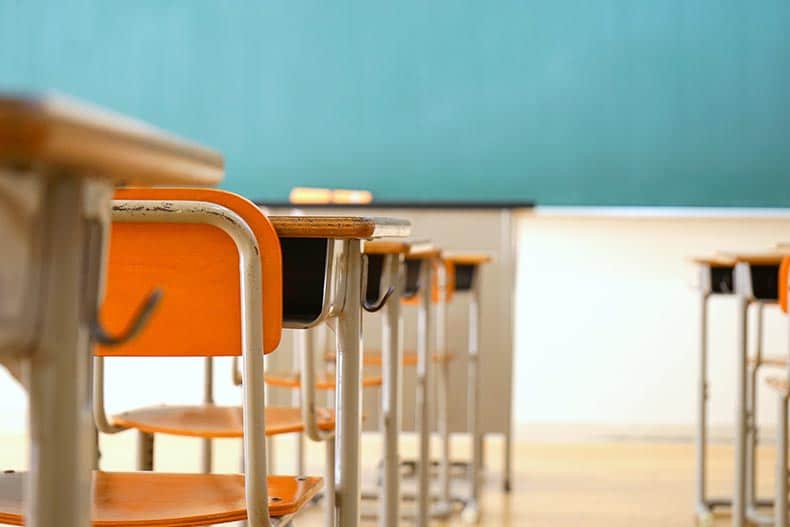 A row of desks in a public school.