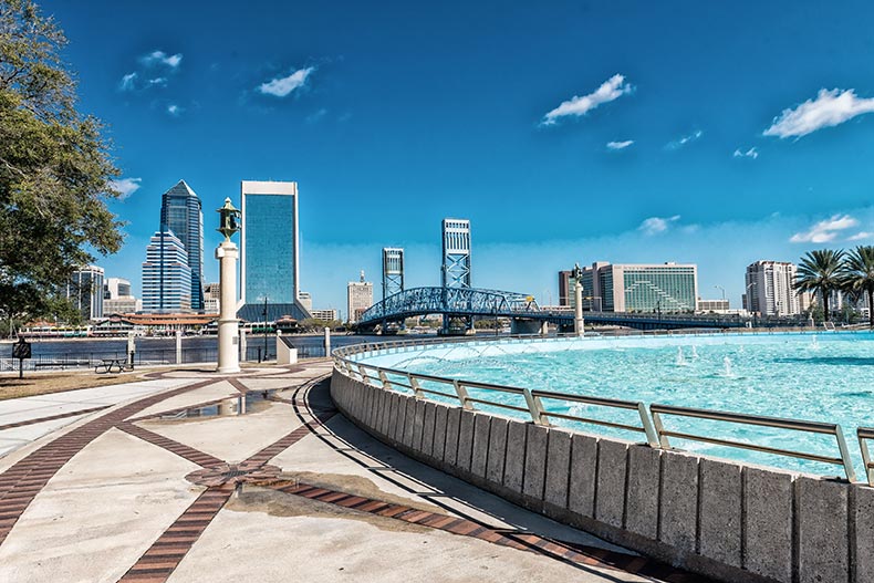 View of the Jacksonville skyline from beside a fountain in Florida.