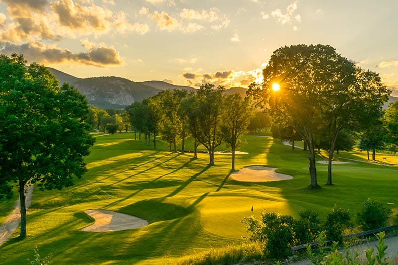 The sun setting over a New Hampshire golf course.