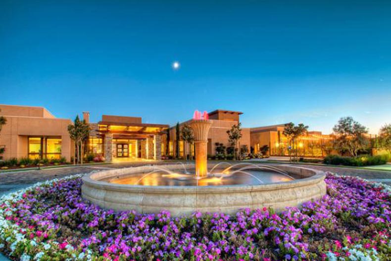 Flowers surrounding a fountain outside the clubhouse at Trilogy® at the Vineyards in Brentwood, California.