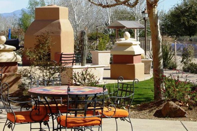 Tables and chairs on the outdoor patio at Rancho Resort in Sahuarita, Arizona.