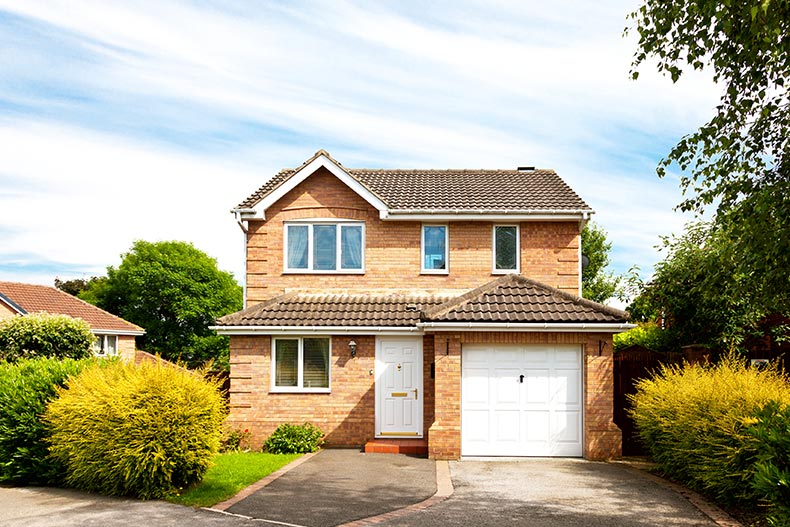 Exterior view of a single-family house with an attached garage.