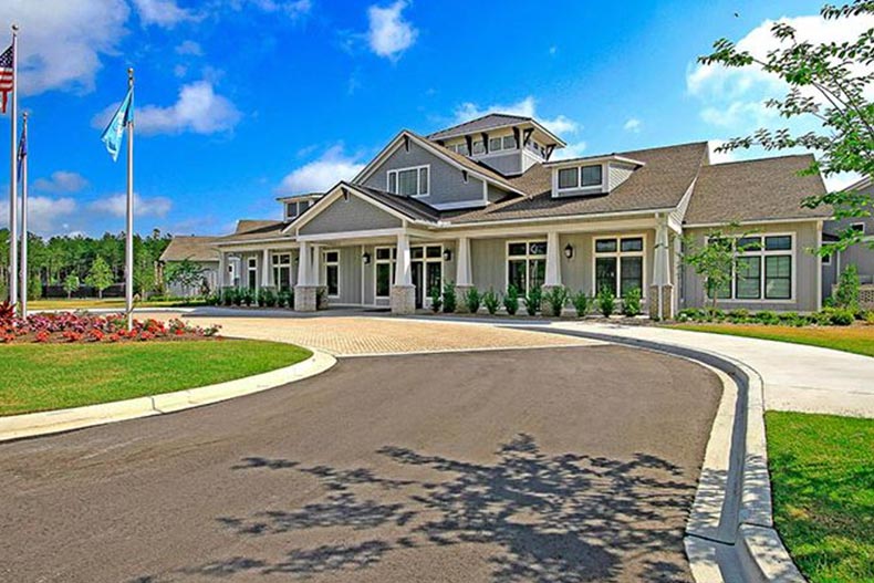 Exterior view of the clubhouse at the entrance of Four Seasons at The Lakes of Cane Bay in Summerville, South Carolina.