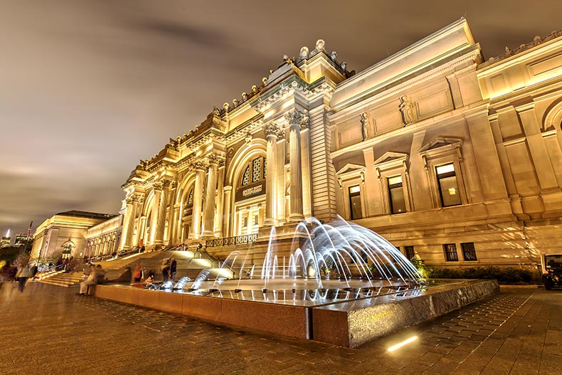 Exterior view of The Metropolitan Museum of Art in New York, New York at night.